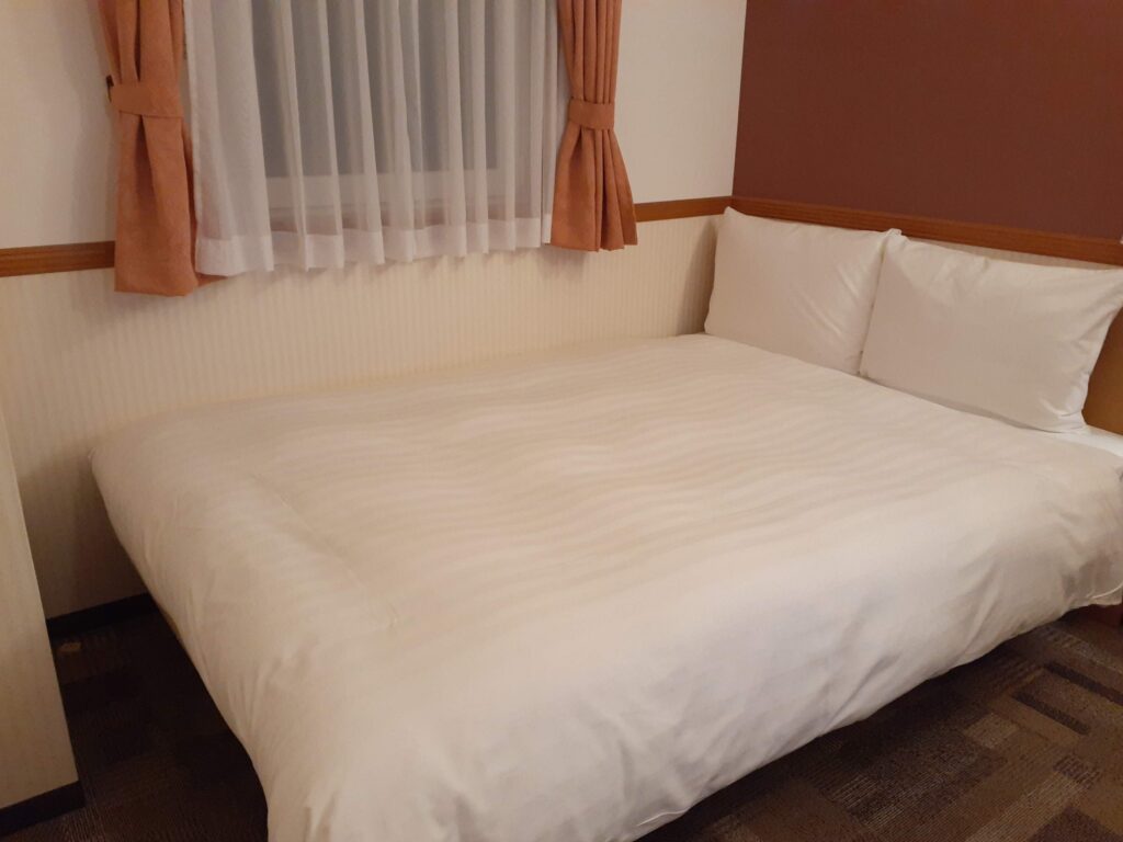 Double bed in Toyoko Inn