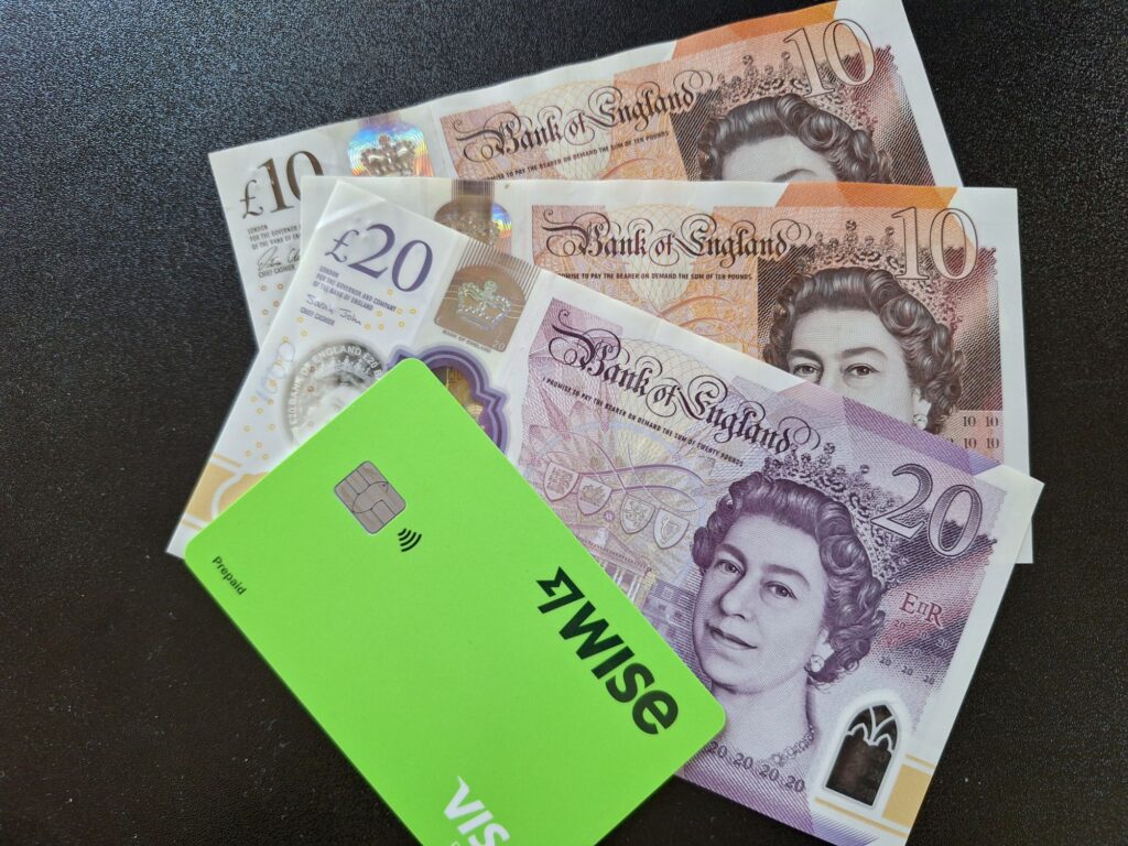 Wise card and British cash, £10, £20 notes
