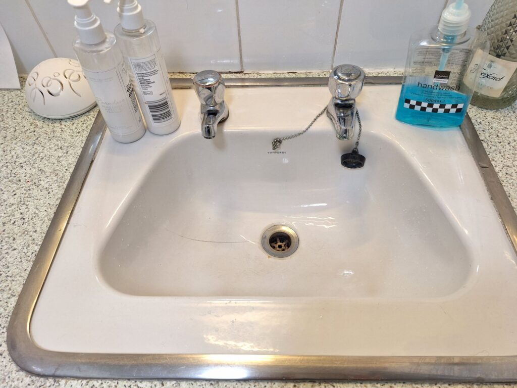 Separated water valves in a washroom in a pub in England 
