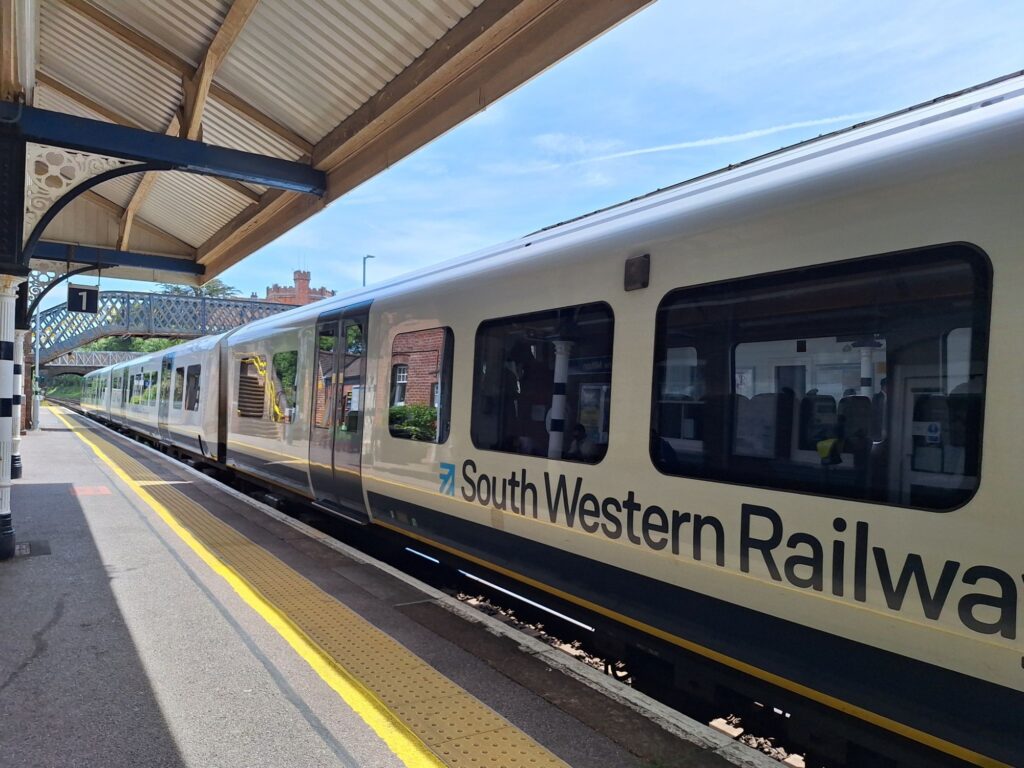 A train to Brockenhurst on the platform of New Milton station 
