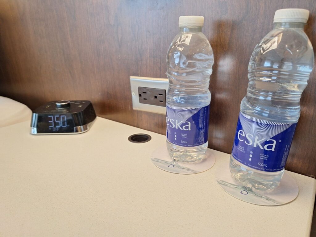 Two bottles of water by the bed 