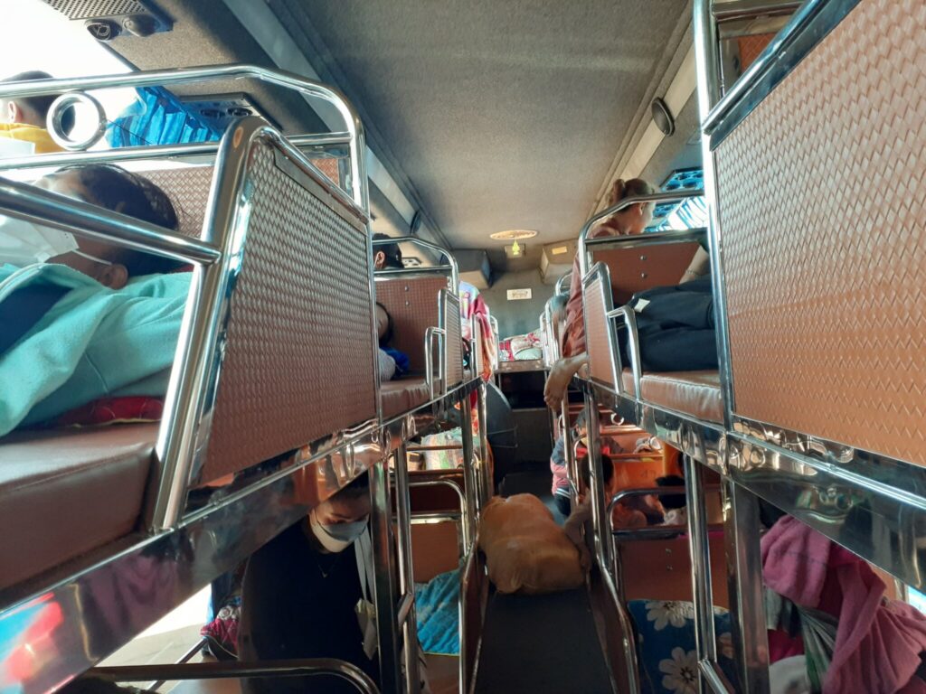 The interior of the bus to Thakhek, with rows of bunk beds