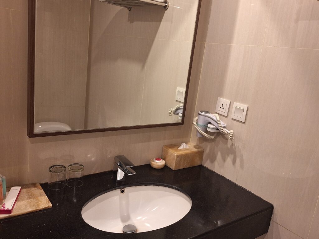 Bathroom in Orchardz Hotel Bandara