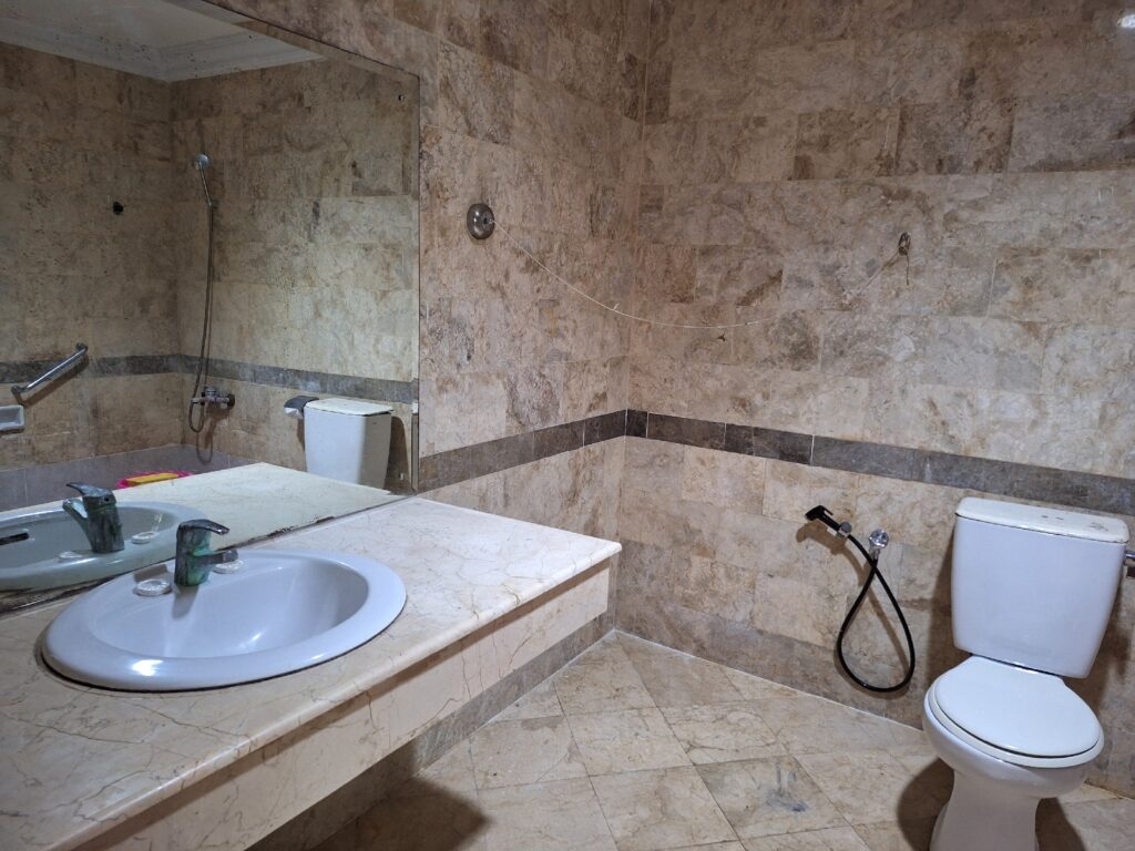 The bathroom in Nirmala Beach Hotel and Resort