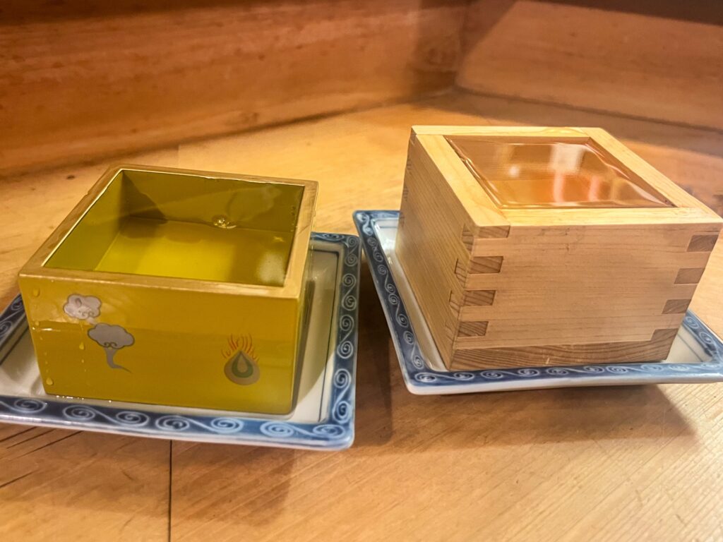 Sake in a square wooden cup (Masu)