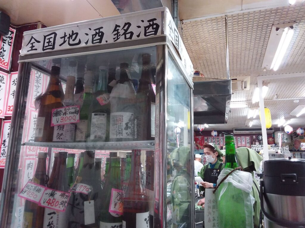 Sake fridge in a standing bar in Japan