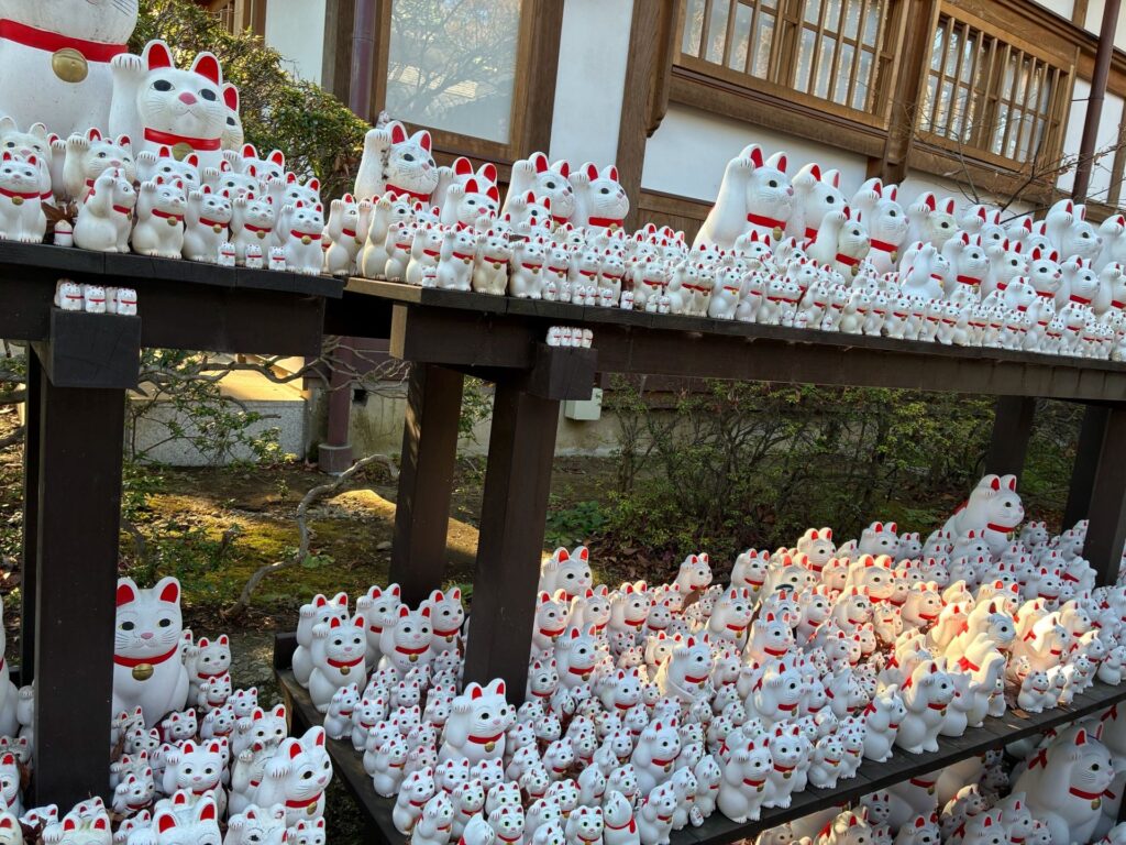 maneki-neko (the Japanese beckoning lucky cat) in Gotokuji Temple, Tokyo