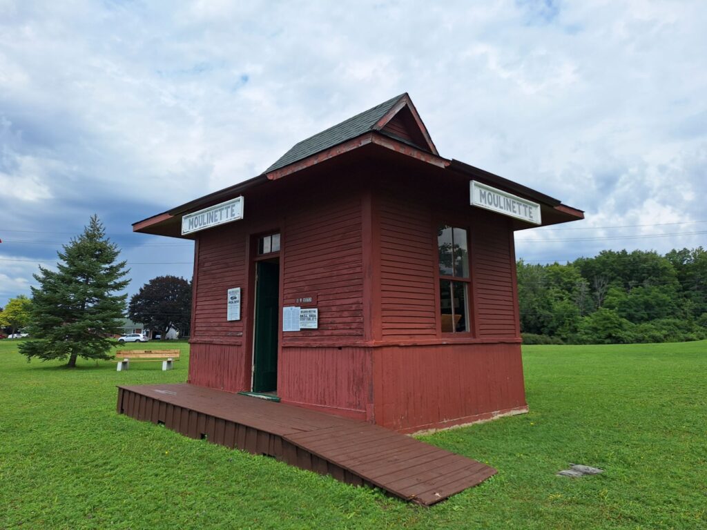 The iconic red railway station, a centerpiece of the museum grounds.