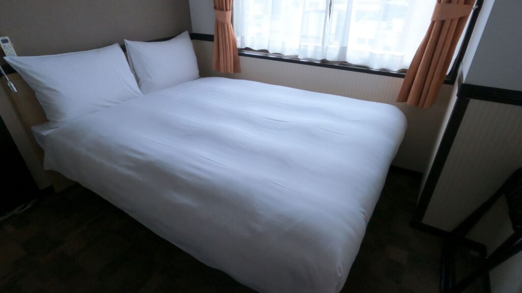 A semi double bed in Toyoko Inn Fukushima-eki Nishiguchi