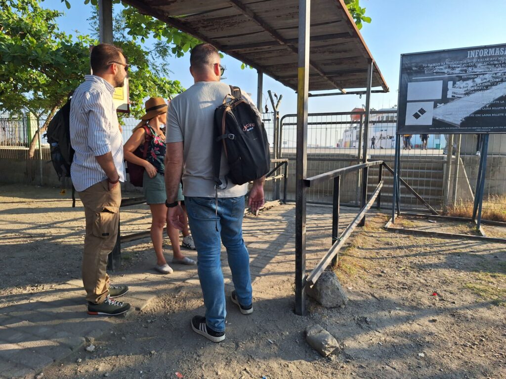 Waiting tourists at the boarding gate in Porto Dili