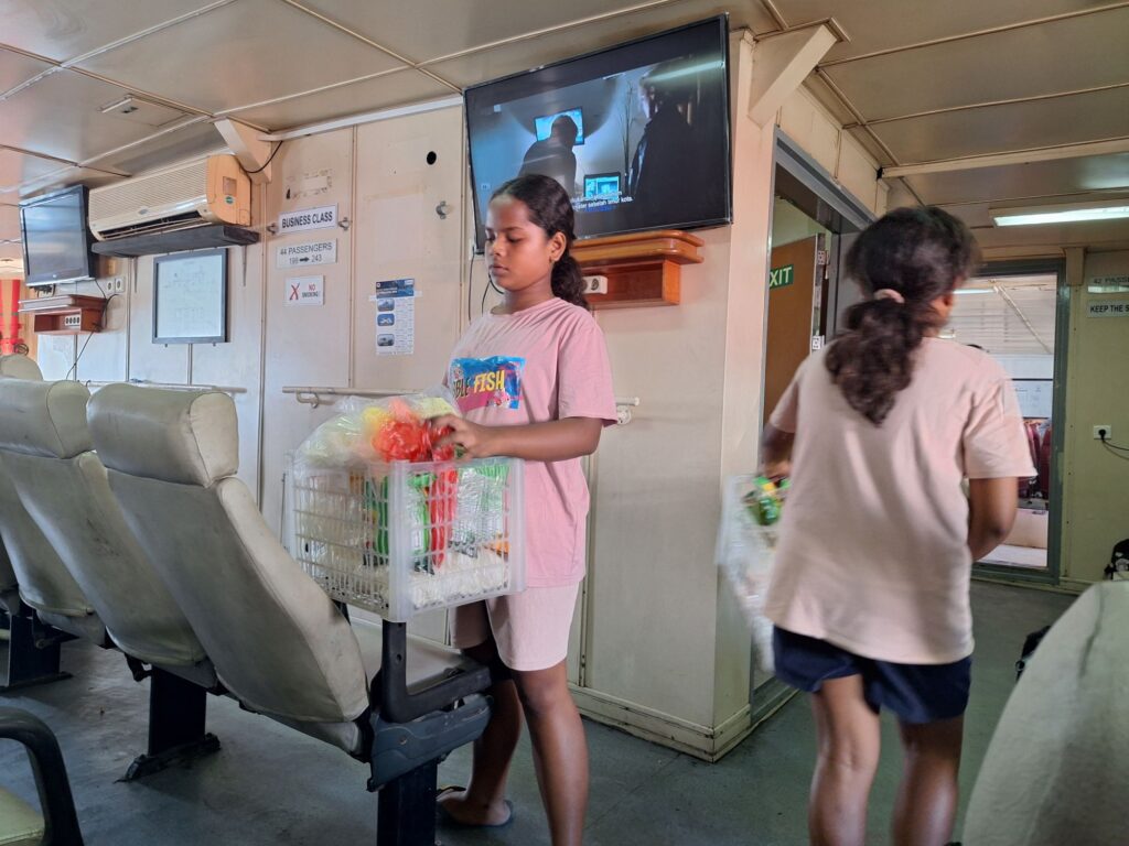 A food vender in the ferry to Atauro island 